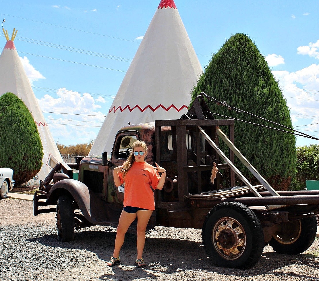 Daughter in cool pose in front of Mater at the Wigwam Hotel in Holbrook Arizona