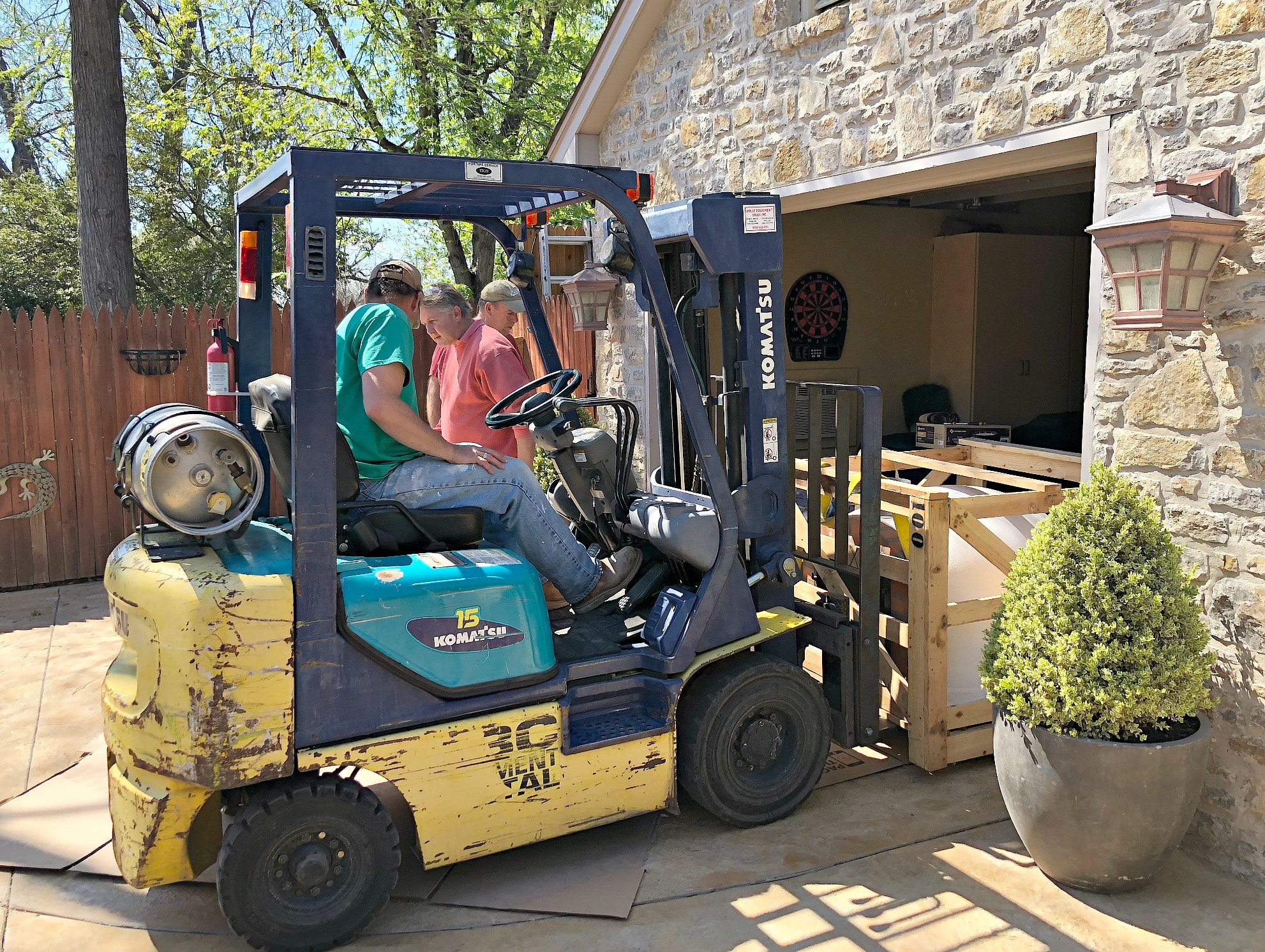 loading pizza oven crate onto forklift