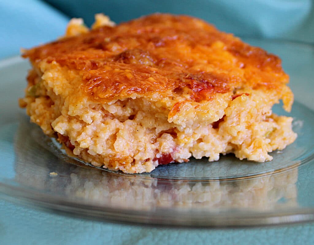 savory cheese grits close up on a clear plate