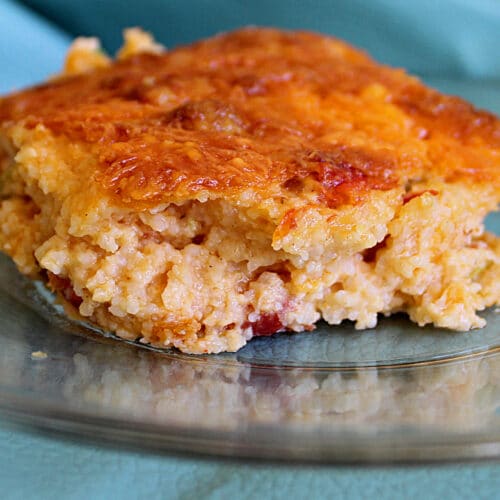 savory cheese grits close up on a clear plate