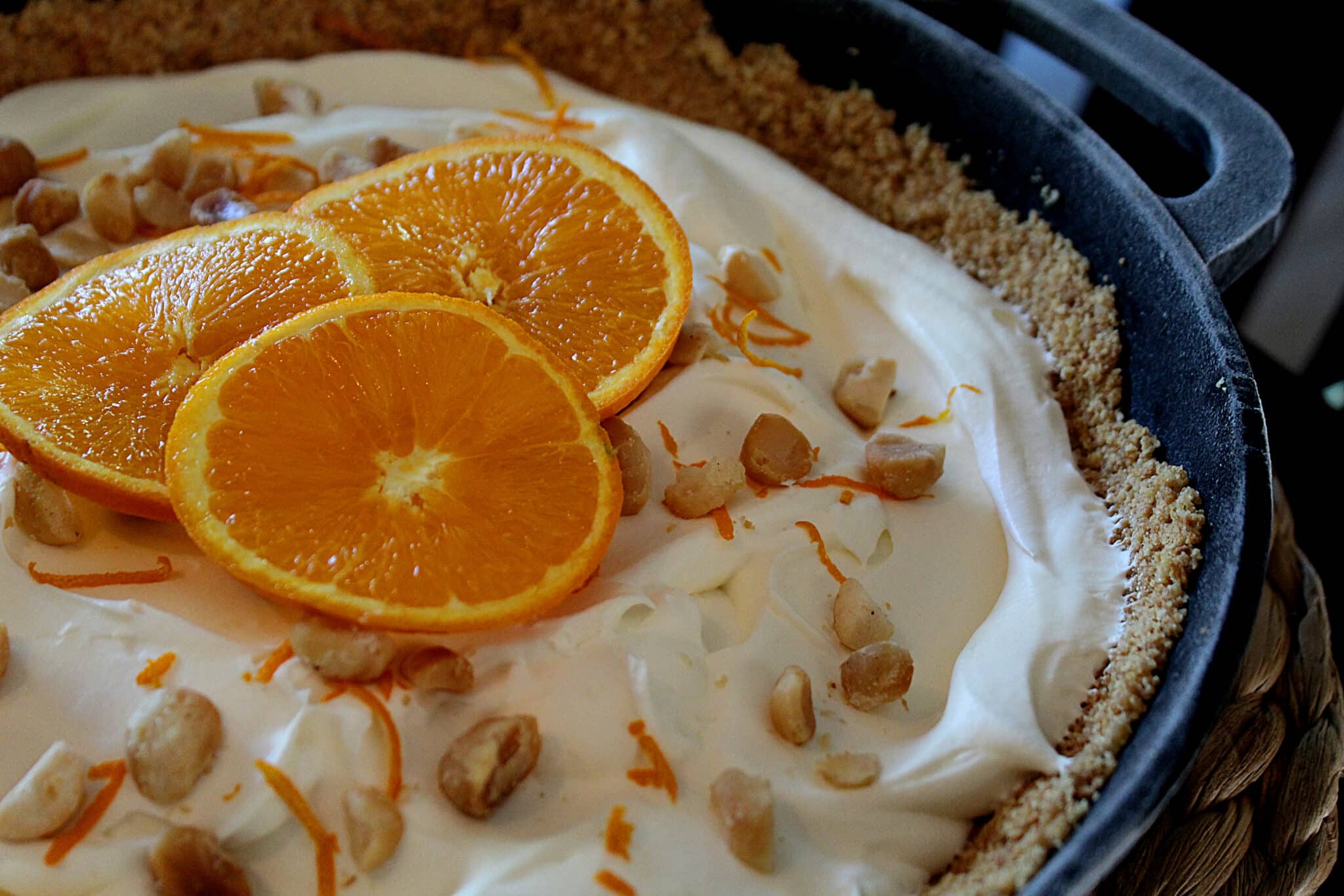 Orange Cream Dreamy Cast Iron Icebox Pie with orange zest macadamia nuts in a graham cracker crust