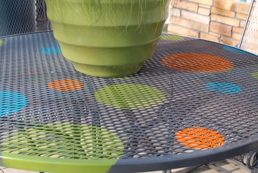 diy Wrought Iron Patio Furniture redo on the back patio with a green planter on top