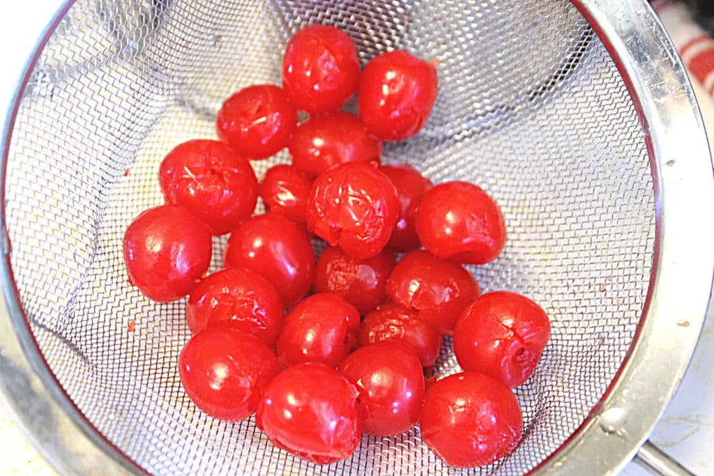 cherries in a strainer