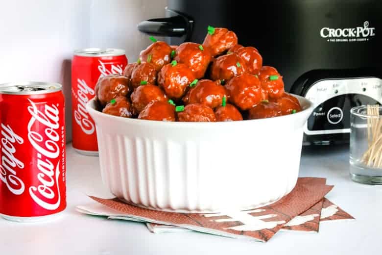 coca cola crockpot meatballs in a white bowl