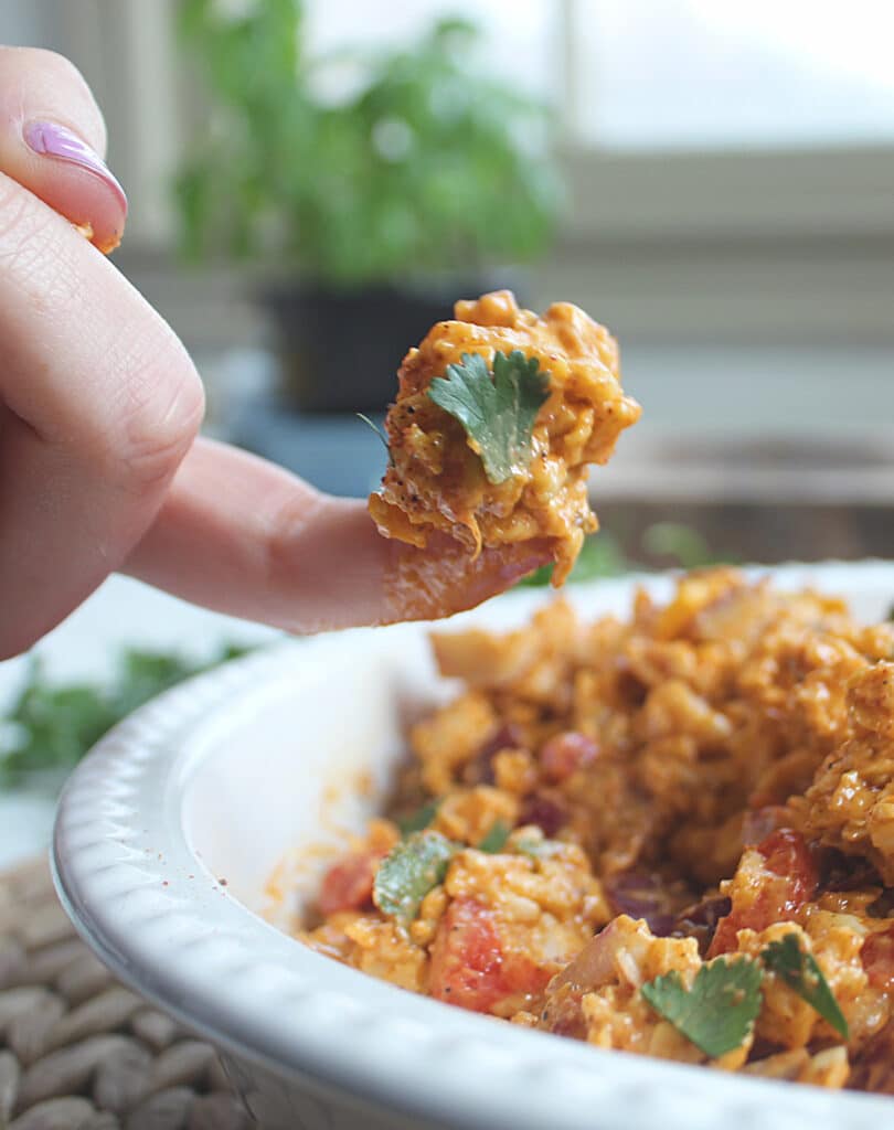 Close up of a finger scoop of pimento cheese