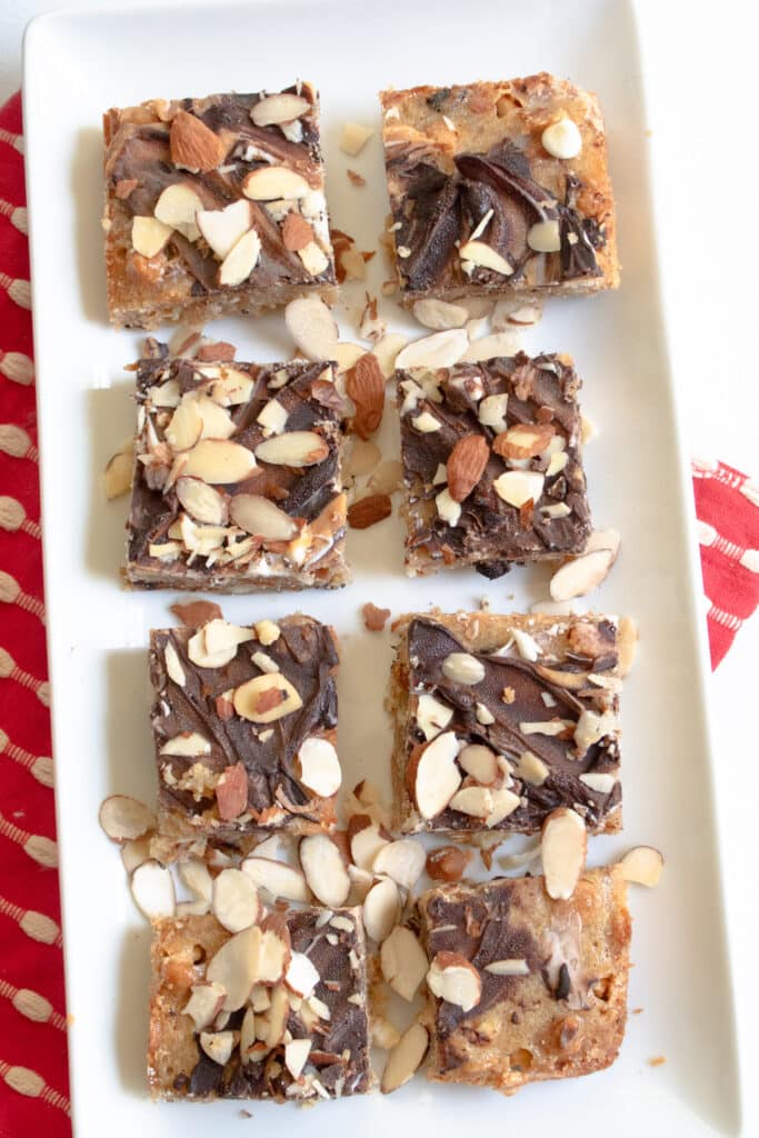 overhead of blondie banana brownies with chocolate swirl and sliced almonds on top