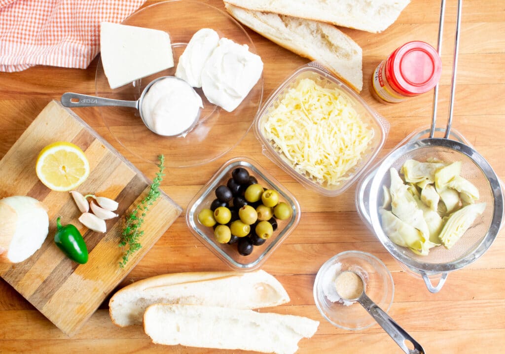 overhead picture of all ingredients needed for artichoke cheese bread