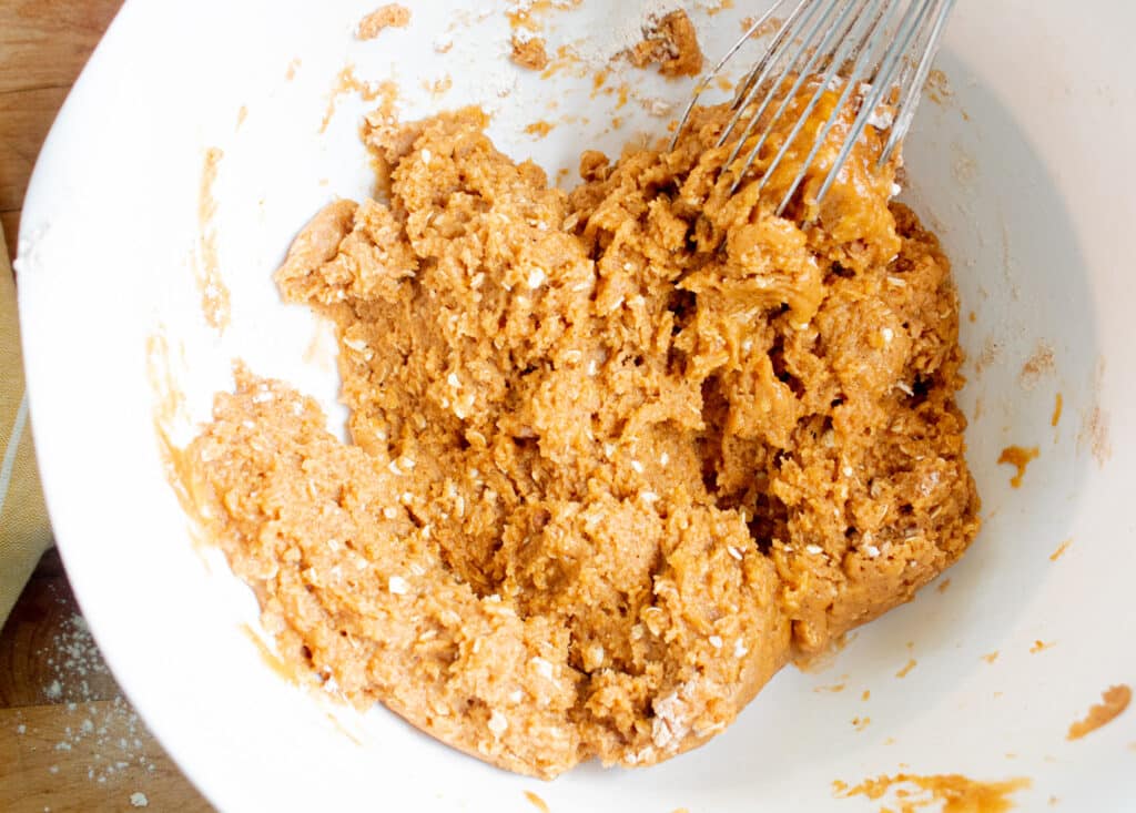 pumpkin chocolate chip cookie mix in a white mixing bowl