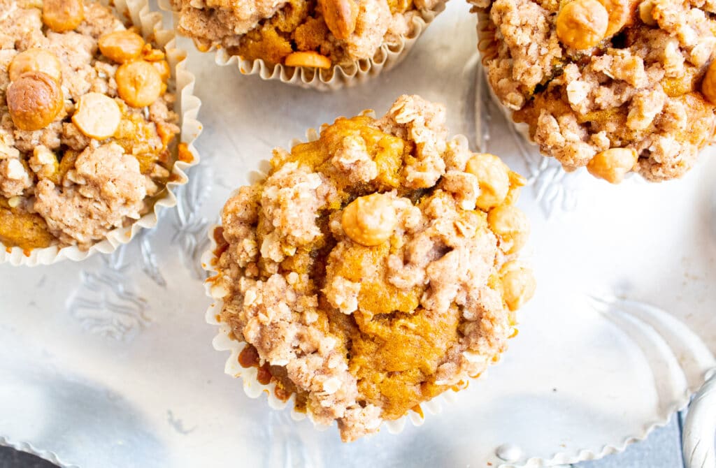 overhead close up of pumpkin muffin with oat butterscotch topping on a retro silver tray