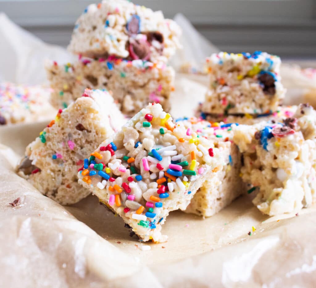 Easy sweet and salty rice krispie treats cut up on a plate on parchment papaer