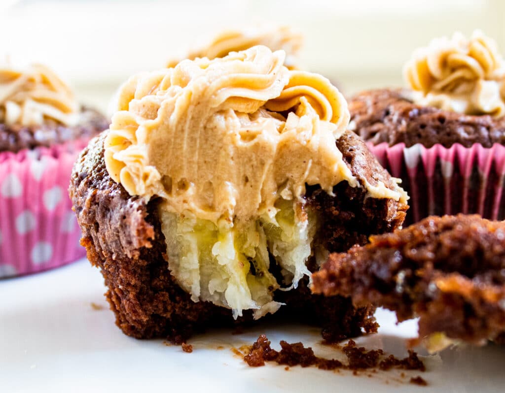 close up of a brownie banana cupcake with a bite out of it