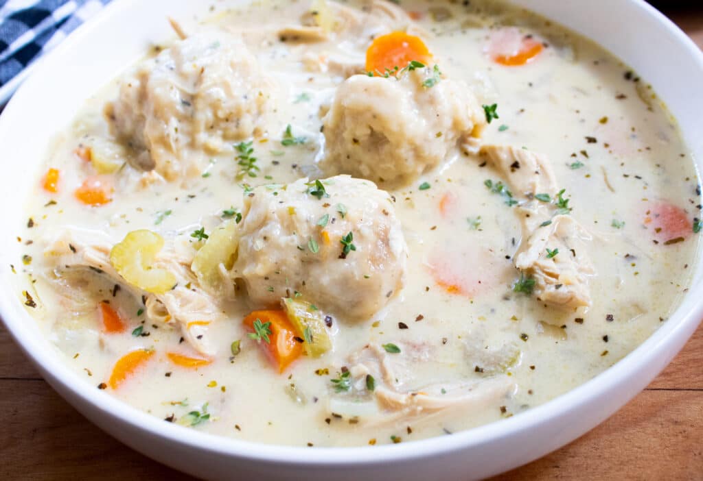 comforting easy old fashioned chicken dumplings in a white bowl