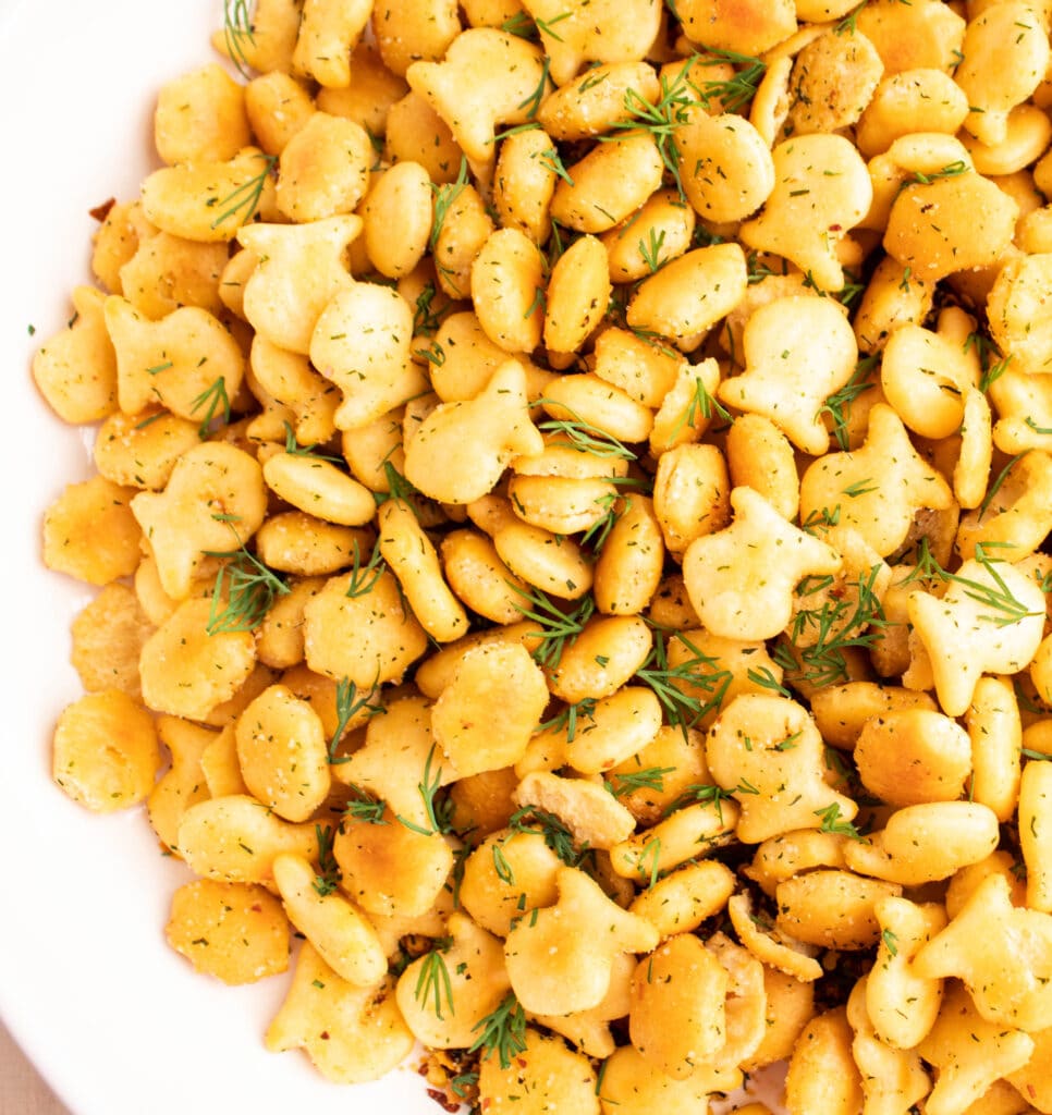 close up overhead of golden italian oyster goldfish crackers with extra dill.