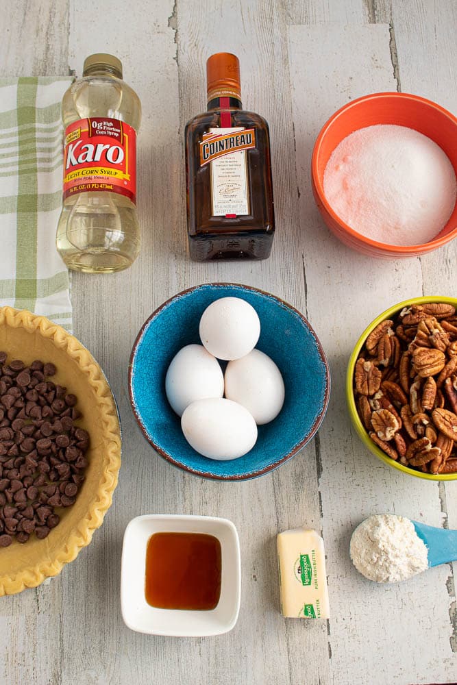 Chocolate Orange Pecan Pie ingredients on a grey table.