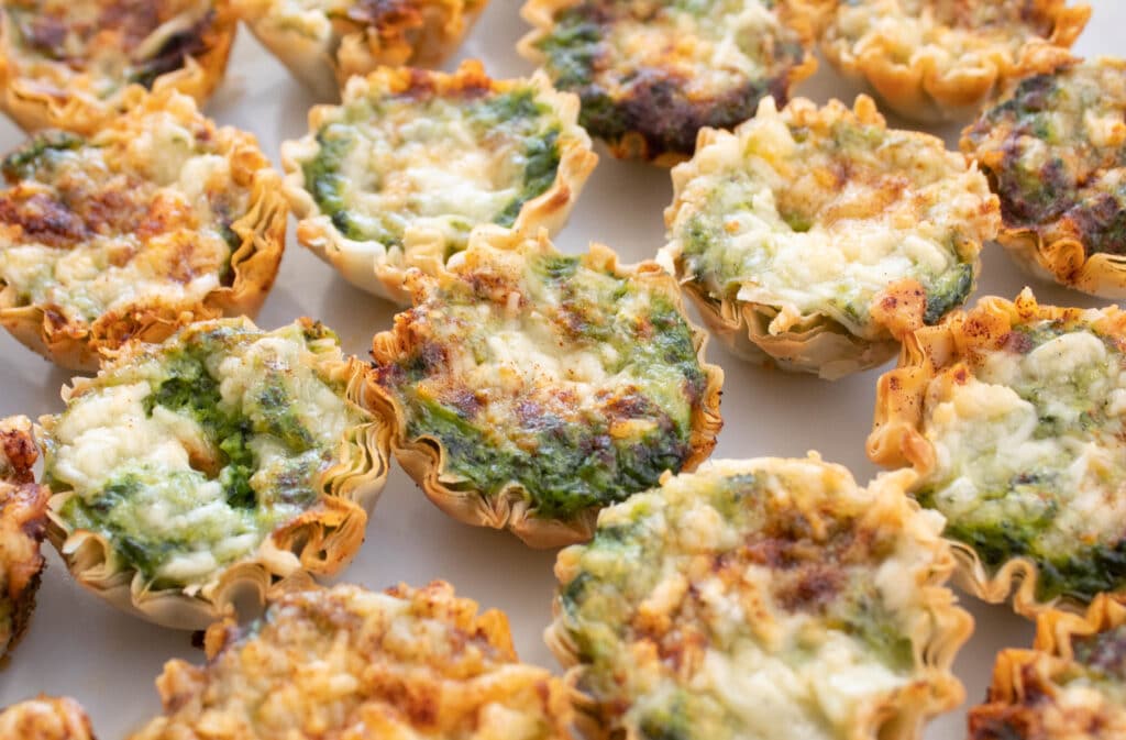 Mini Spinach Souffle bites on a large serving tray.