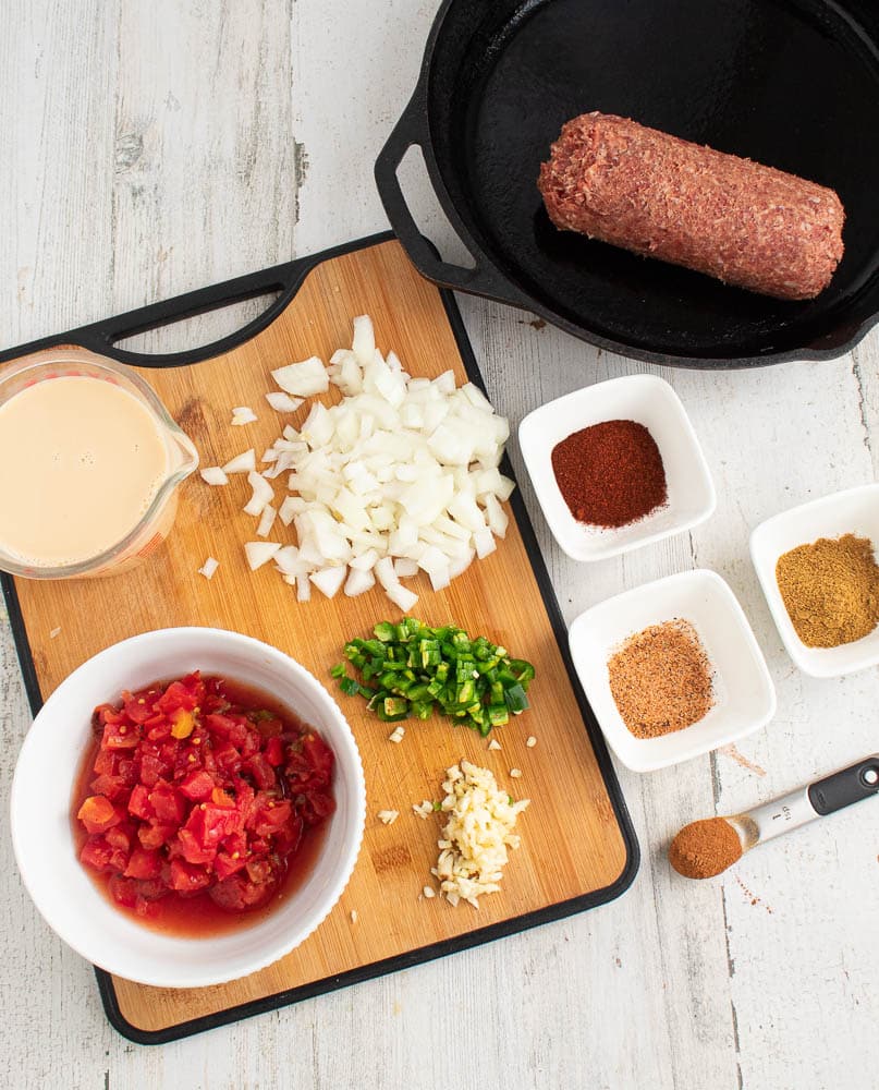 Spicy Rotel Queso Dip ingredients on a white table.