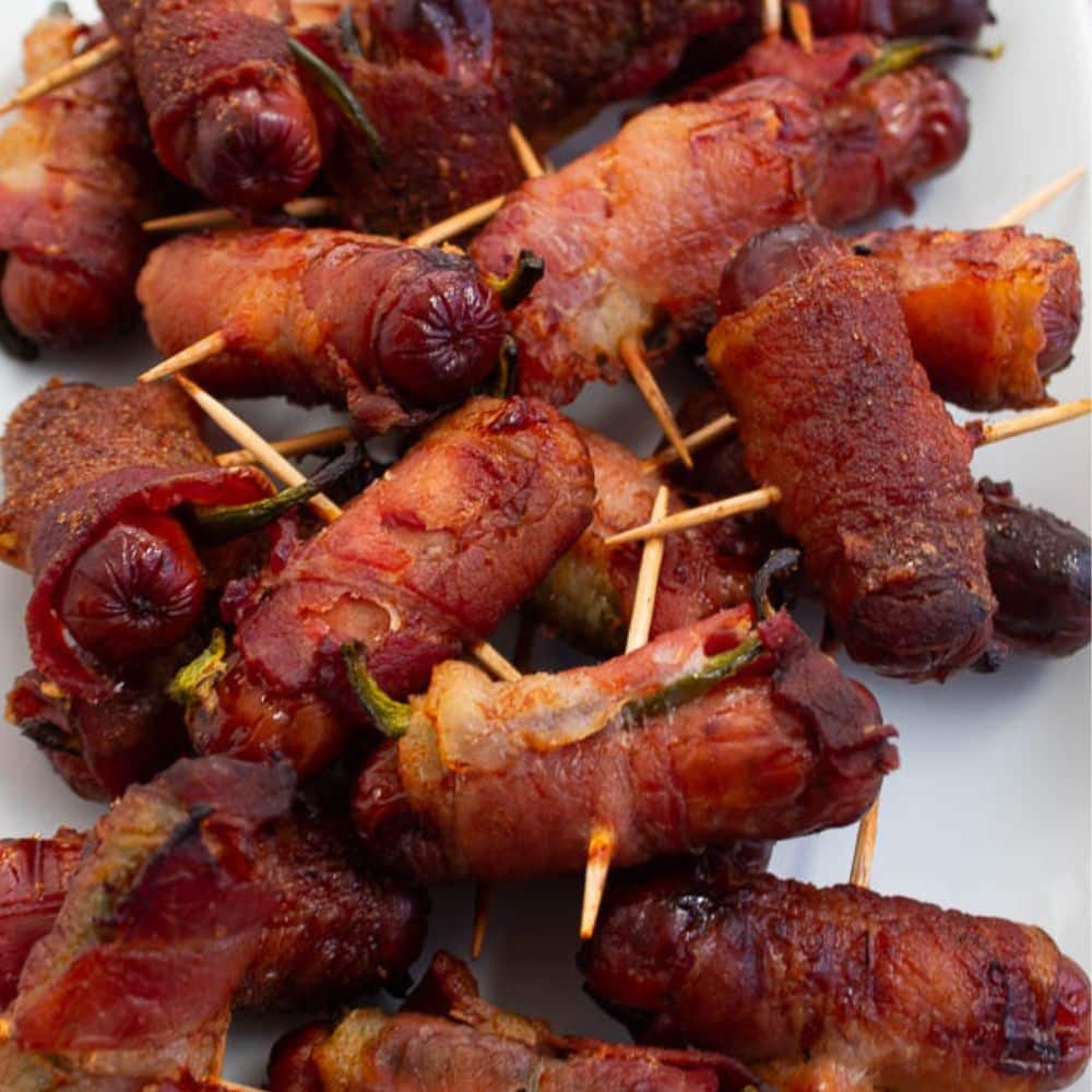 Fully cooked brown Sugar bacon wrapped smokies and jalapeno close up photo.