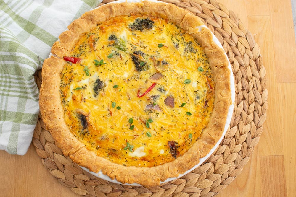 Roasted Vegtable Quiche on a bamboo mat.