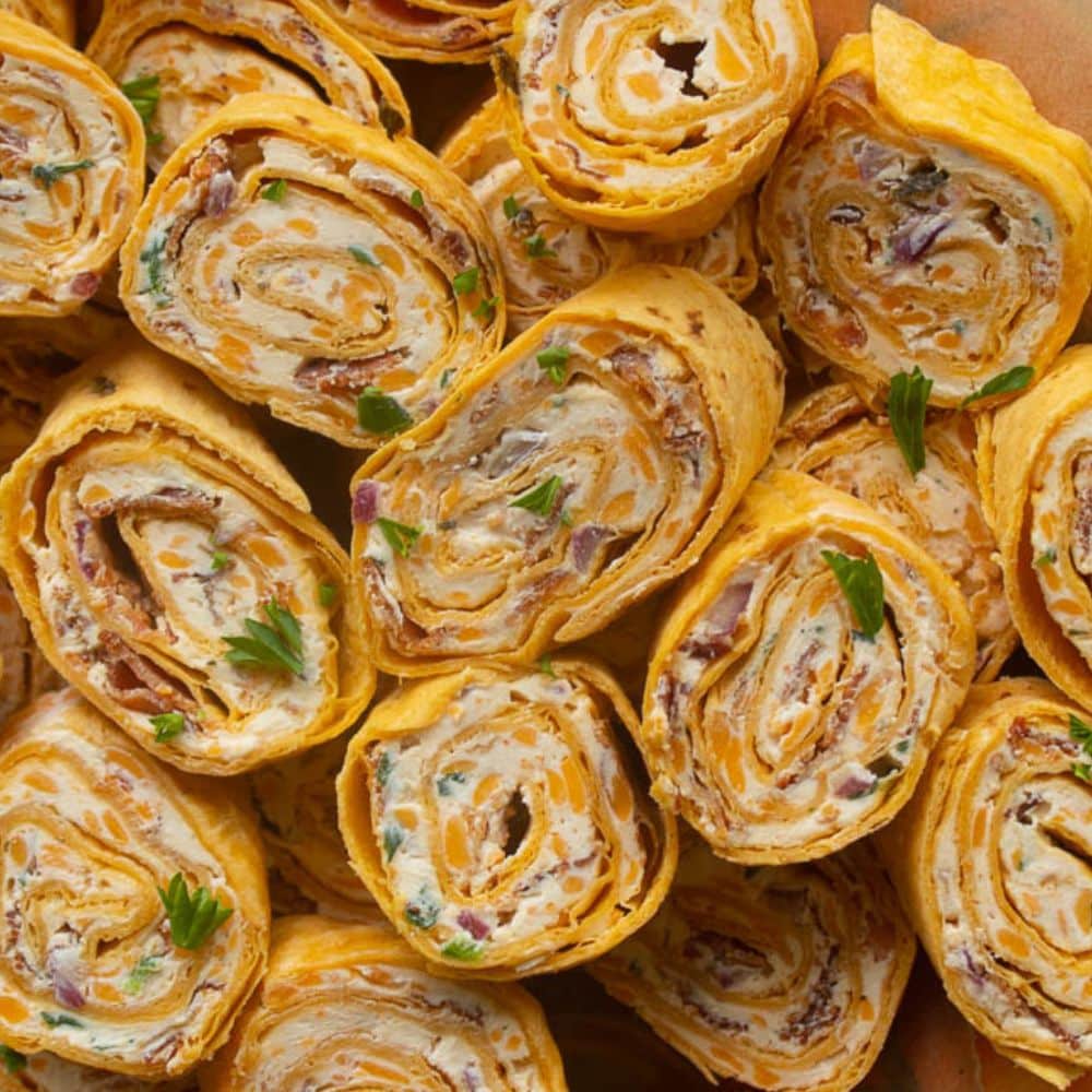 Plate of bacon cheddar ranch tortilla pinwheels roll ups.